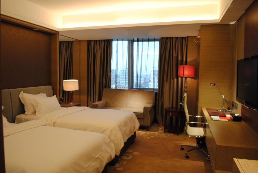 Guangzhou New Century Hotel Zimmer foto